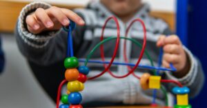 large-a-little-boy-playing-with-a-bead-maze-while-sitting-in-a-waiting-room.jpg_s_1024x1024_w_is_k_20_c_FDnECsuKm9PVZBc53NgXzphNOlb_fSta1Xp8ZW9B3ws_ EHR Connectivity & Interoperability: Future-Proofing Independent Pediatric Practices